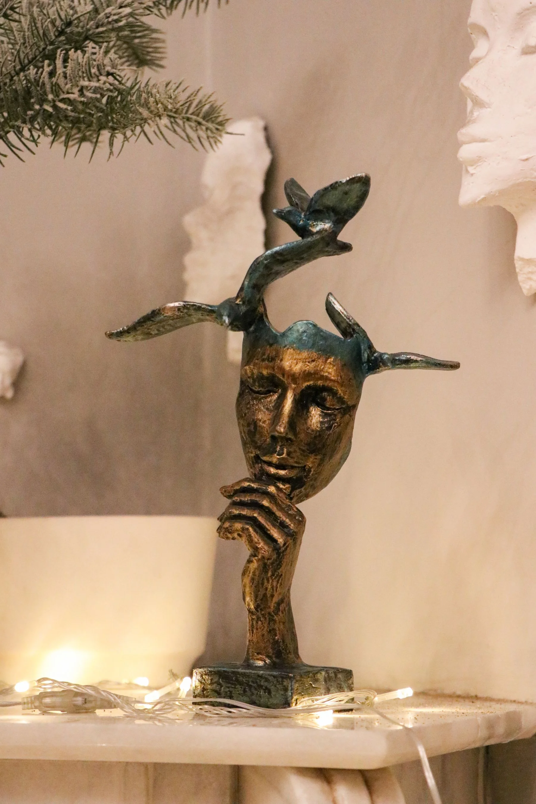 Bronze sculpture of an abstract face