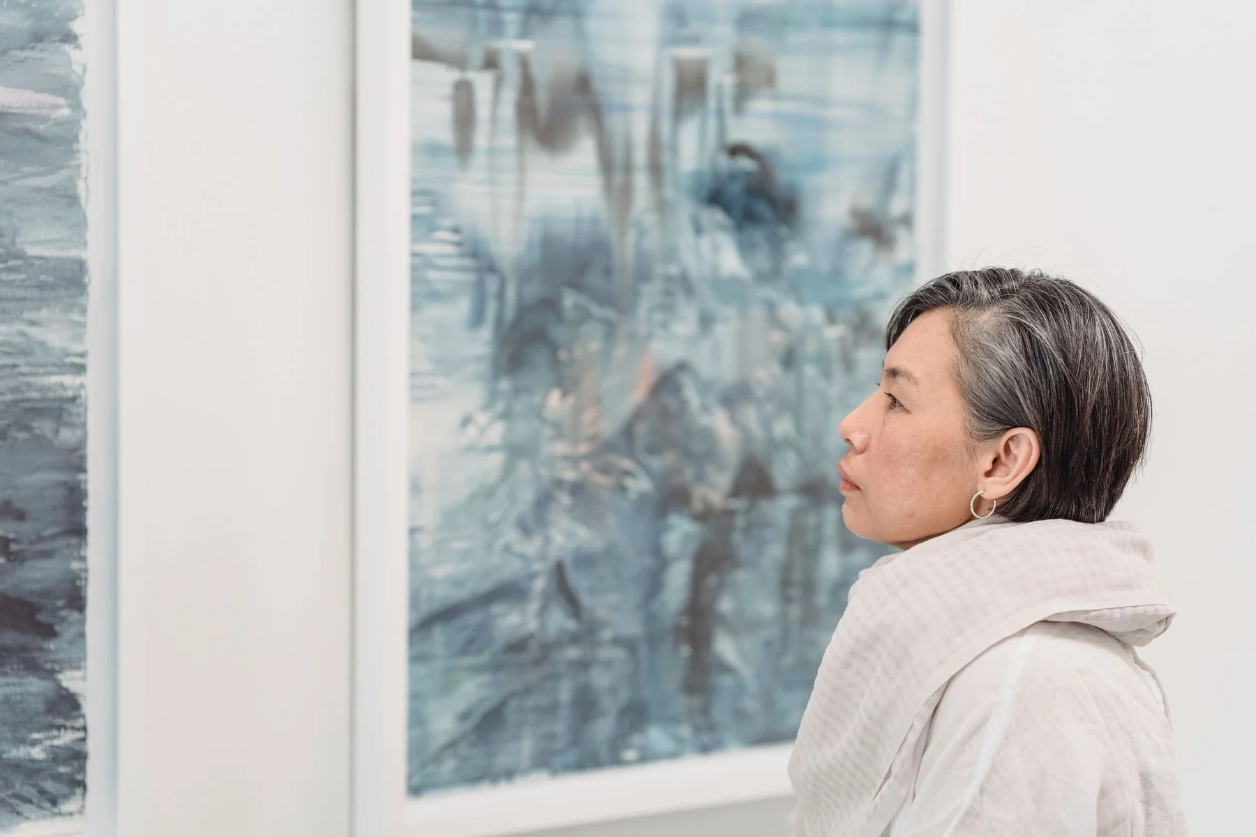 Visitor looking at an abstract painting