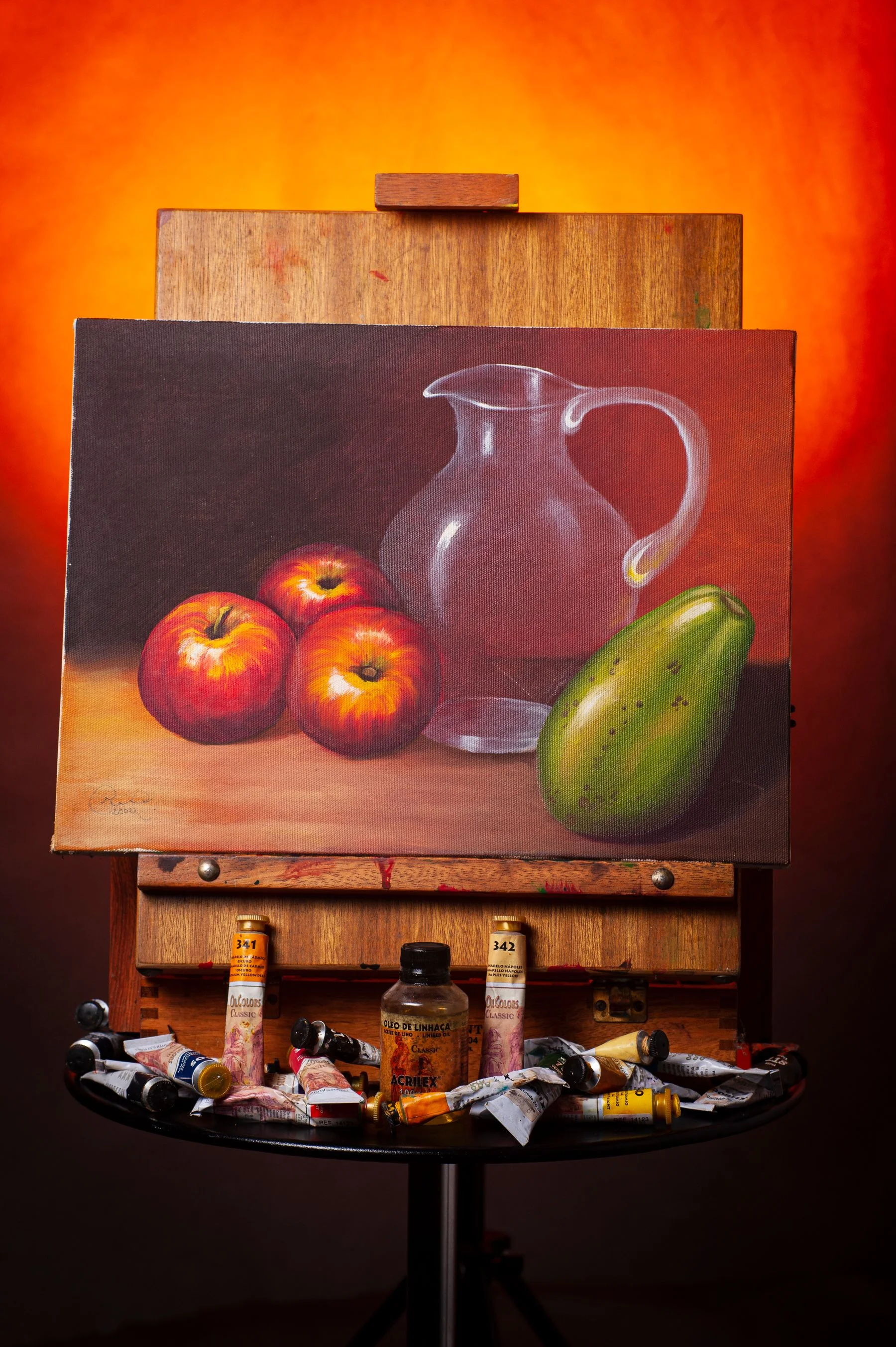 Still life painting of fruit and a glass pitcher