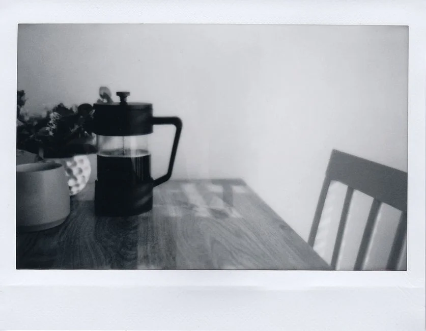French press filled with freshly brewed coffee