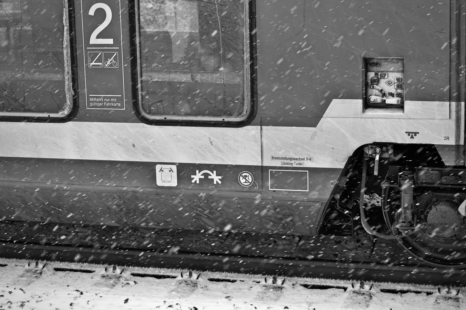 A train arriving through falling snow