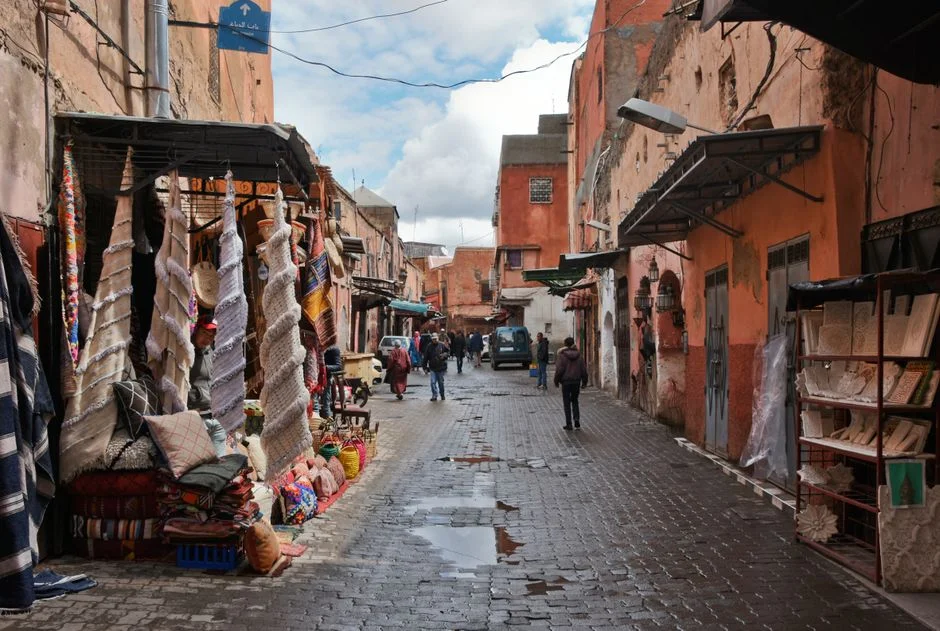 A souk lane hung with woven textiles