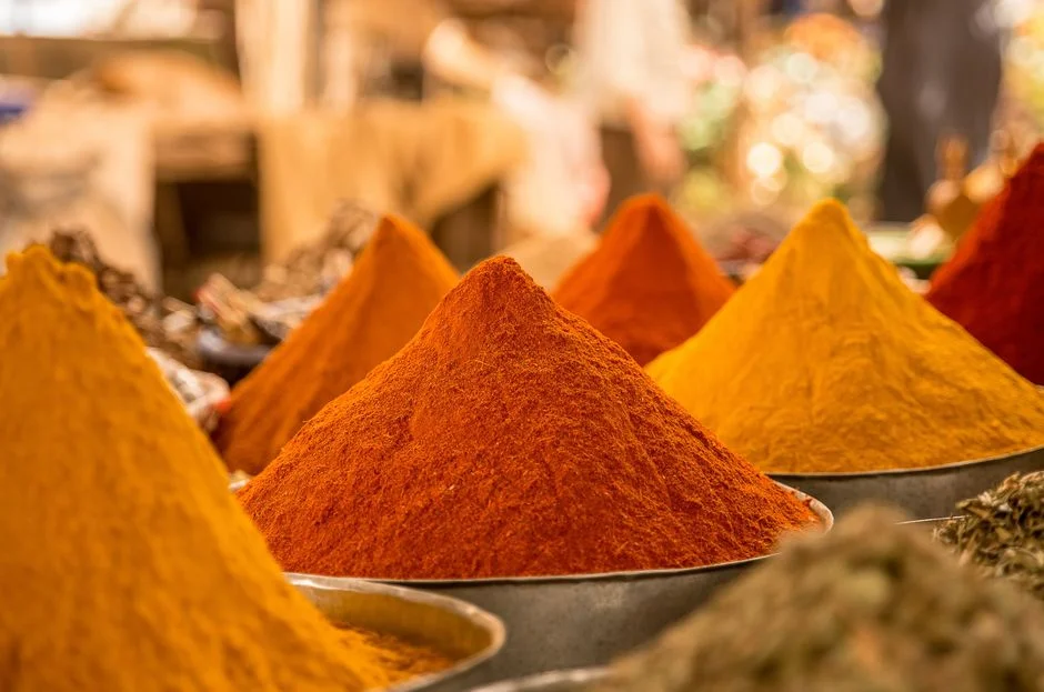 Pyramids of saffron and paprika at a spice stall